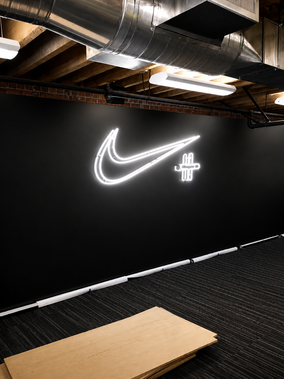 A glowing white neon Nike