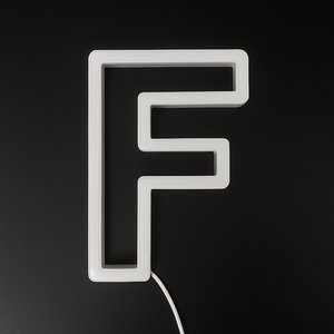 Neon light shaped like the letter 'F' on a black background