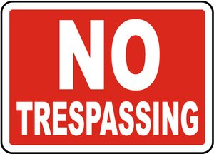 No Trespassing sign with red background