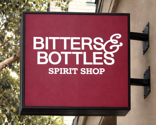 Red sign with 'Bitters & Bottles Spirit Shop