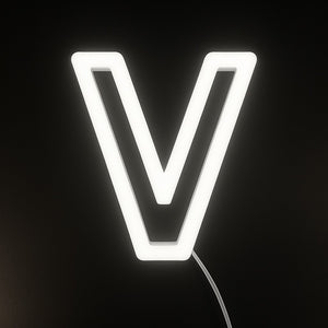 Neon light shaped like the letter 'V' on a black background