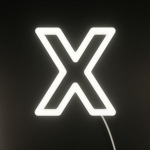 Neon light shaped like the letter 'X' on a black background