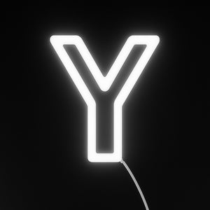 Neon light shaped like the letter 'Y' on a black background