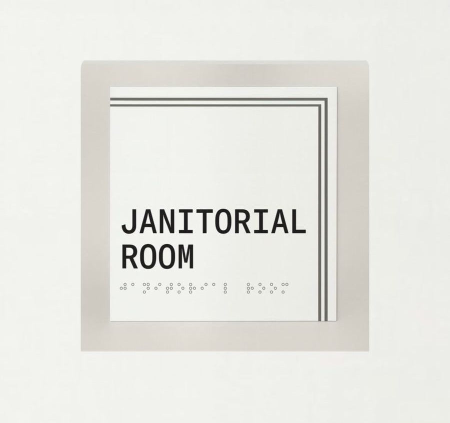 Framed sign with 'Janitorial Room' text on a white background